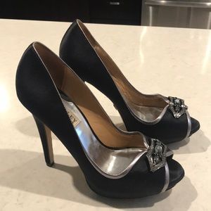 Black satin and silver open-toe pumps with brooch